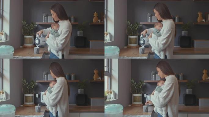 4k视频片段，一名妇女在制作热饮料时抱着婴儿