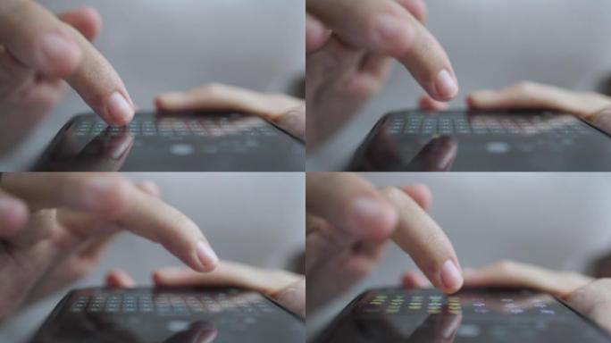 双手特写年轻女子在智能手机上使用和触摸