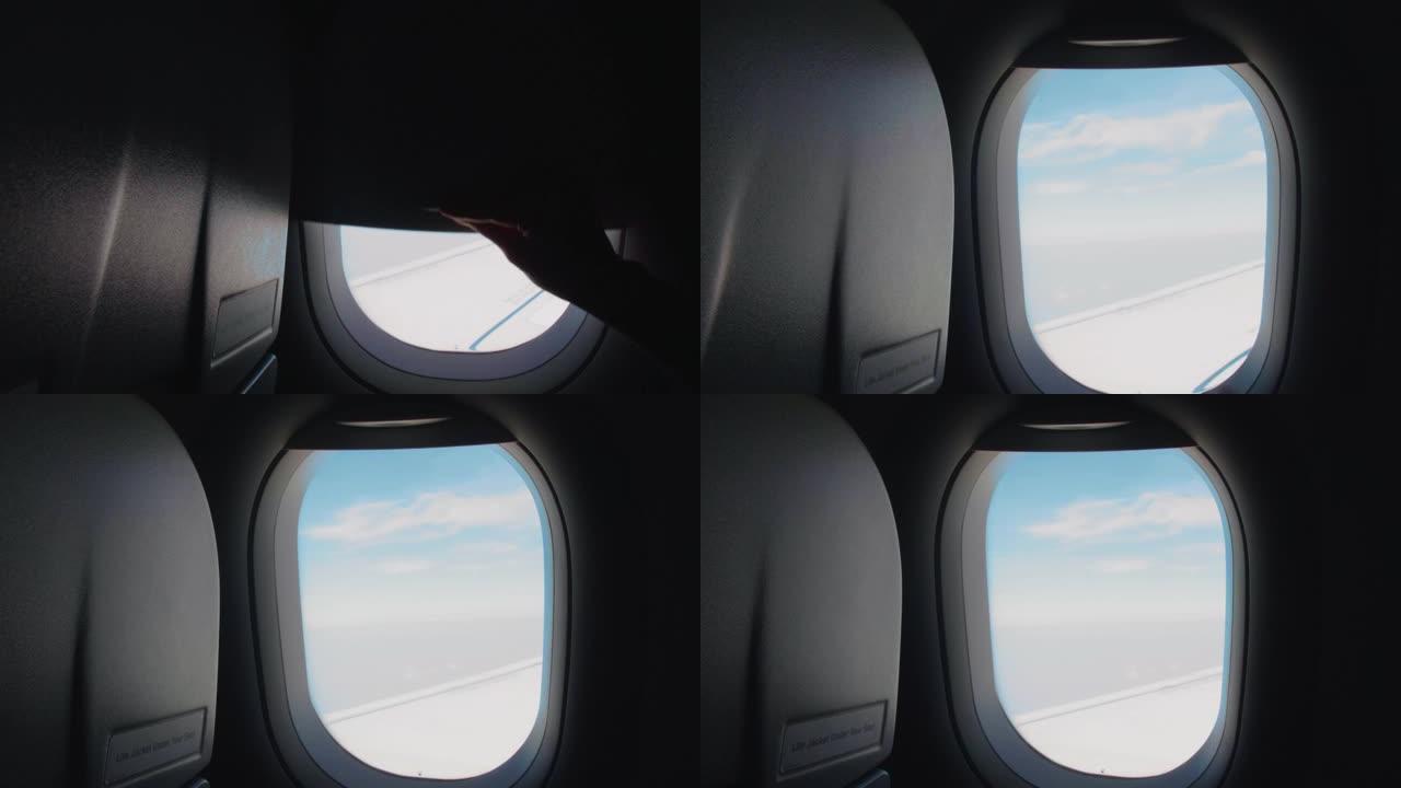 穿过天空和云上的飞机窗户