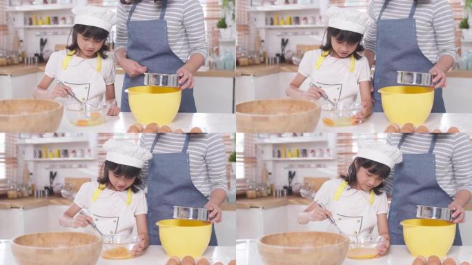 亚洲妈妈教女儿在家学习烹饪