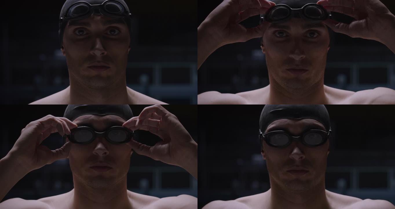 年轻的职业男游泳者戴着泳帽的电影镜头正在戴上护目镜，然后开始在游泳池中练习和训练。运动、竞争、胜利、