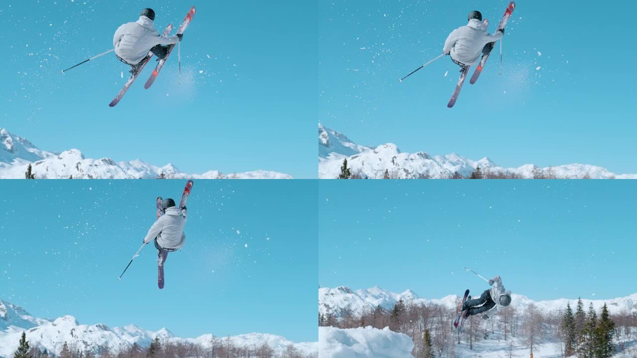 慢动作时间扭曲: 男滑雪者跳下大型踢脚。做一个把戏。