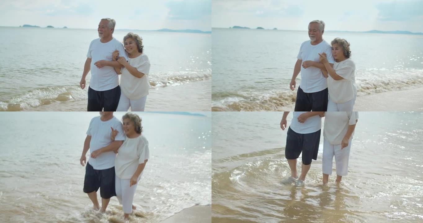 低矮的父亲带着儿子在沙滩上散步，慢动作的场景