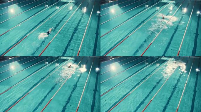 空中俯视图男游泳者在游泳池中，以创纪录的速度跑圈。专业运动员训练比赛，赢得世界冠军自由泳。电影宽固定