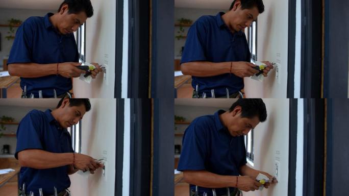 拉丁美洲电工在房屋上固定电源插座