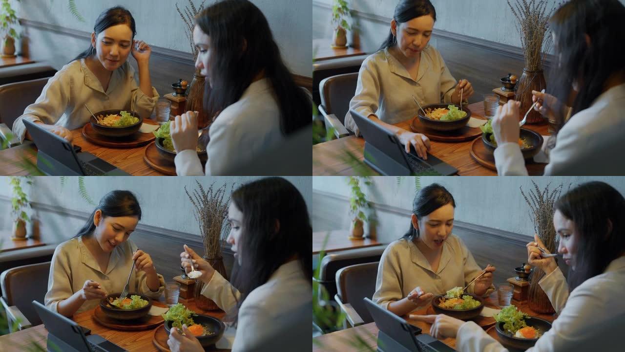 咖啡馆餐厅的亚洲商务女性在商务午餐期间讨论。