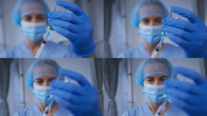 高加索女医生戴口罩为患者制备covid疫苗