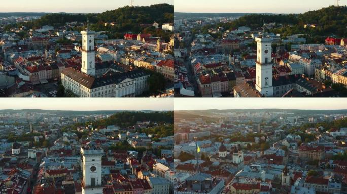 美丽的夏季日出鸟瞰图，在乌克兰利沃夫的旧市政厅建筑与国旗在历史中心。