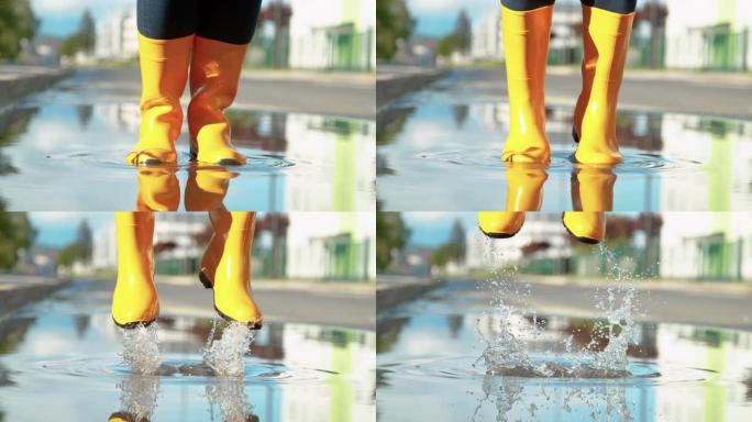 特写: 面目全非的女人穿着黄色雨靴在水坑里跳。