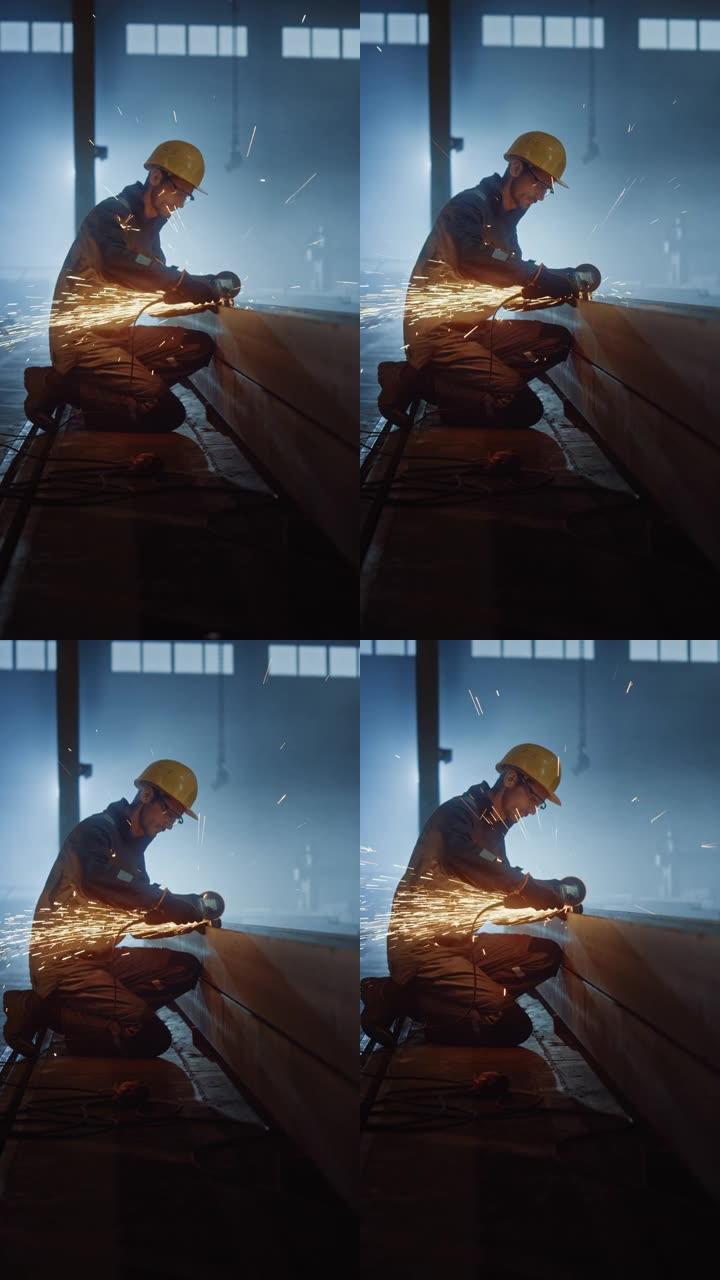重工业工程工厂内部与工业工人使用角磨机和切割金属管。安全和安全帽制造金属结构的承包商。垂直屏幕