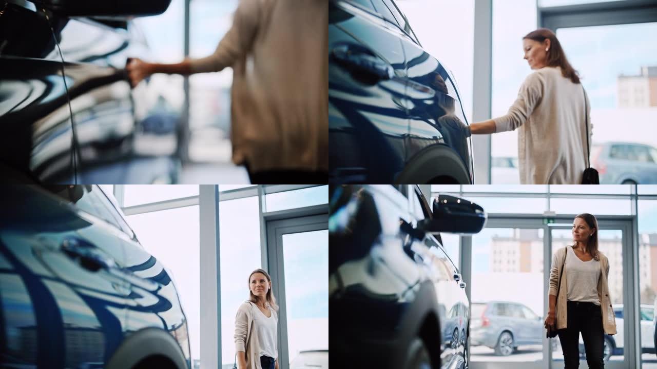SLO MO Mid成年妇女在汽车陈列室里看着一辆新车时，用手爱抚着它