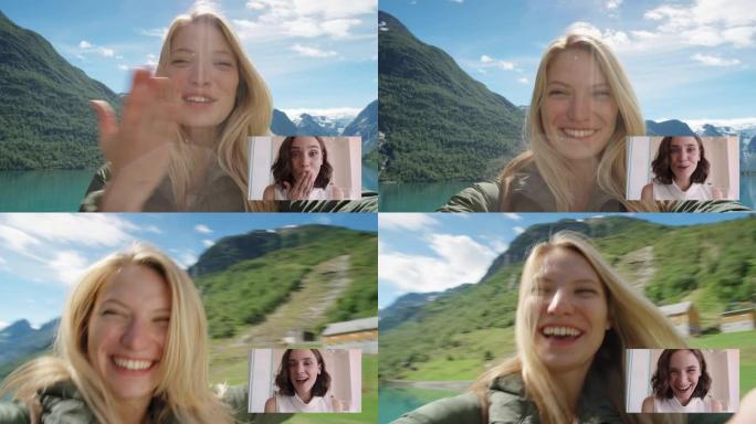 快乐旅行女人视频聊天与最好的朋友吹吻分享假期在挪威享受展示湖泊和自然的乐趣