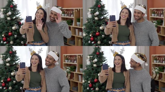 一对年轻夫妇用手机在家里一起庆祝圣诞节的4k视频录像