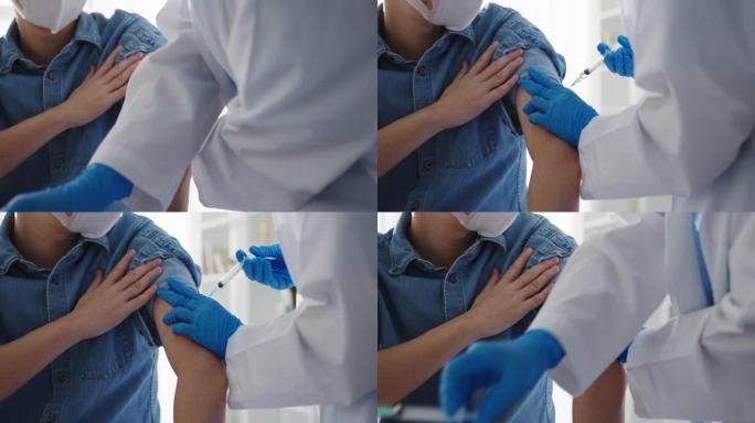 年轻的亚洲女士医生给新型冠状病毒肺炎或流感抗病毒疫苗注射给高级男性患者戴上口罩，防止健康诊所的病毒疾