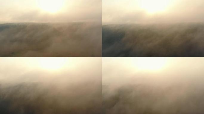 抽象的自然背景，在阴暗的夏季日出时，无人机在树木和河流上飞行成浓浓的白雾雾。
