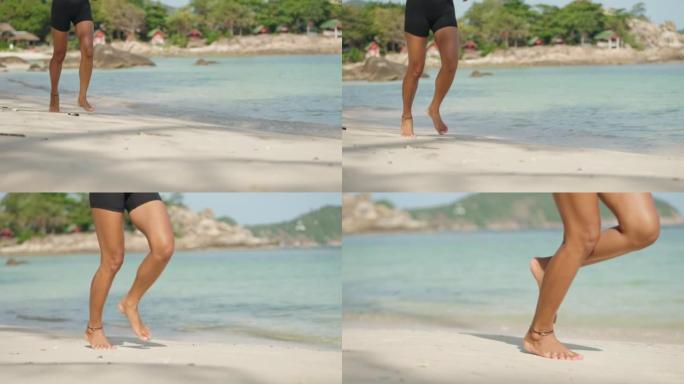 女人在沙滩上慢跑海滨锻炼健身运动阳光活力