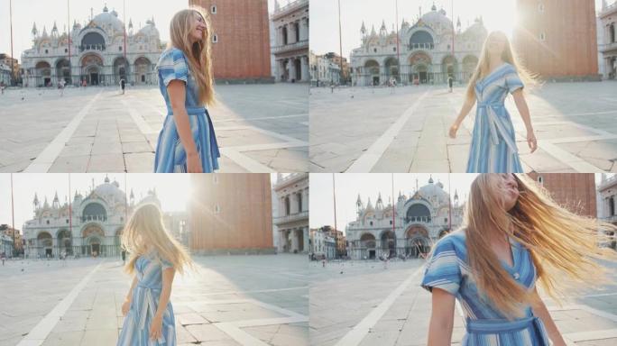 美丽的镜头耀斑肖像快乐微笑的年轻白人妇女在威尼斯空旷的日出圣马可广场摆姿势。