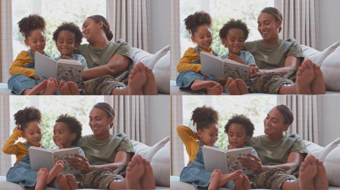 军装妈妈回家休假，孩子们一起在沙发上看书——慢镜头