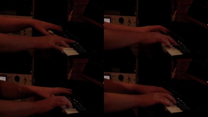 男性手弹电钢琴。特写。