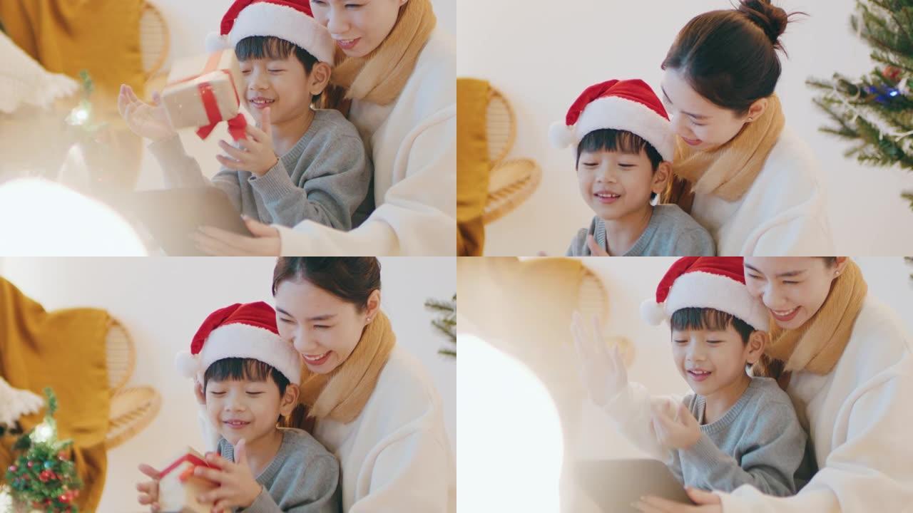 小男孩在线视频通话，父亲庆祝圣诞节社交距离。
