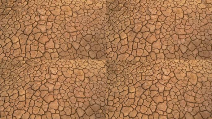 空中自上而下: 长期干旱造成的干燥土地和破裂土壤的视图