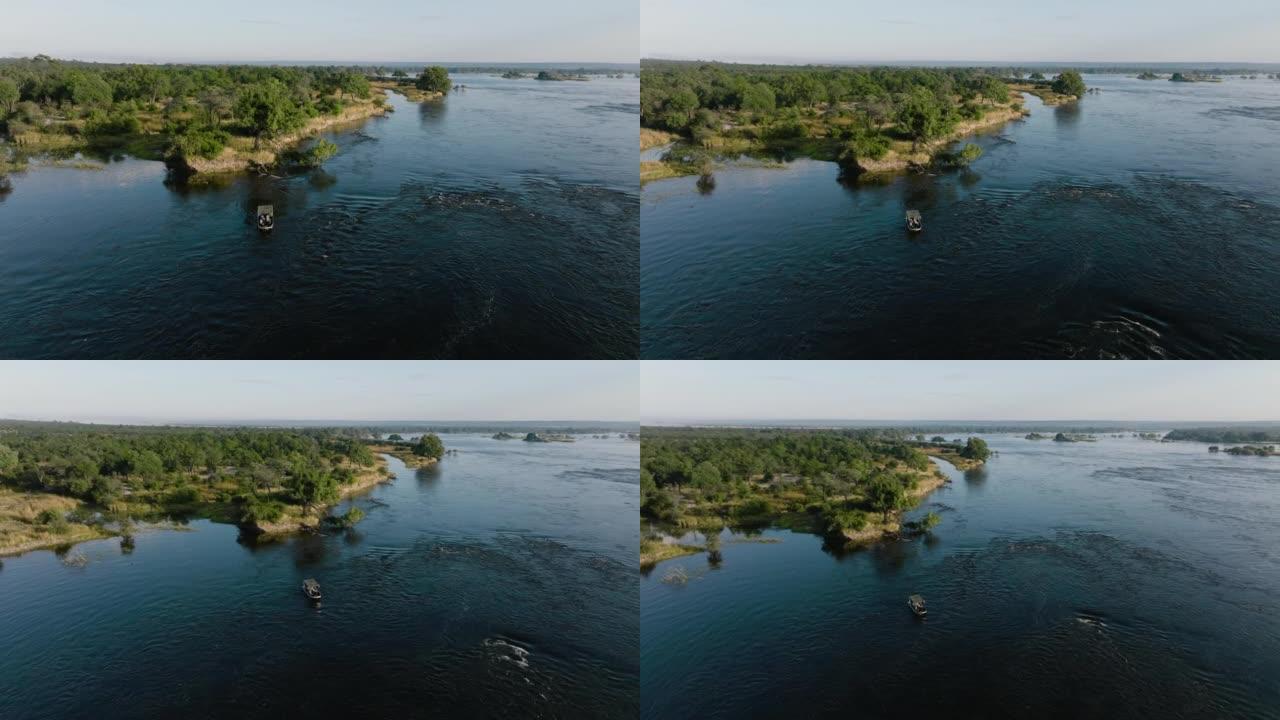 在赞比西河上观光的旅游船的空中缩小视图