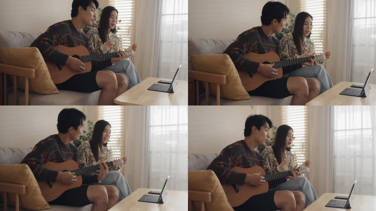 亚洲朋友通过互联网上的视频通话一起播放音乐。