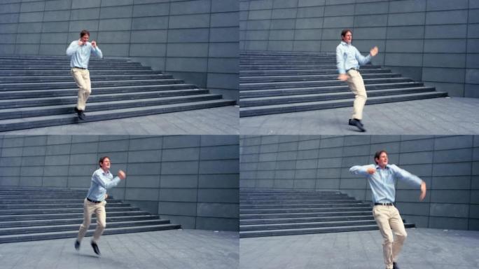 一个年轻商人在城市跳舞的4k视频片段