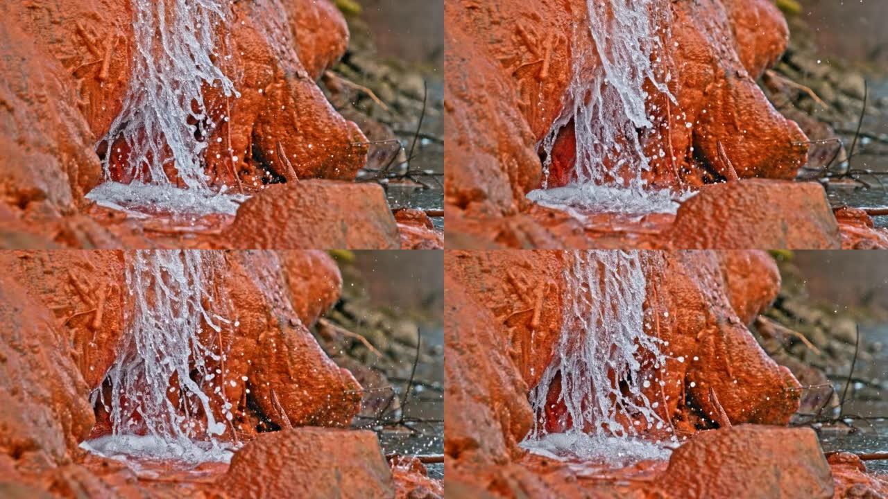 清晰的淡水流过岩石的特写镜头