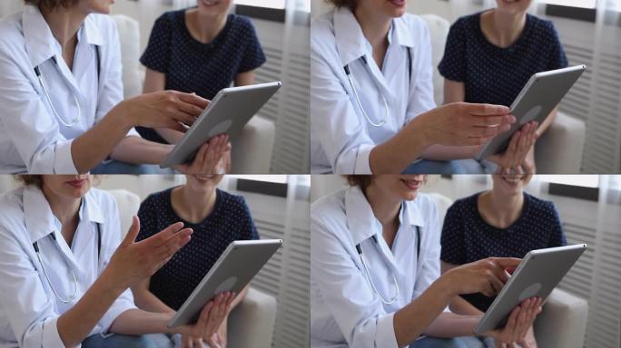 医生拿着平板电脑向患者展示医疗测试健康报告