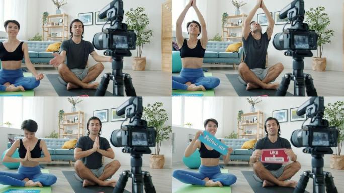 几个视频记录器在瑜伽垫上冥想，然后显示跟随我的标志，为互联网博客录制视频