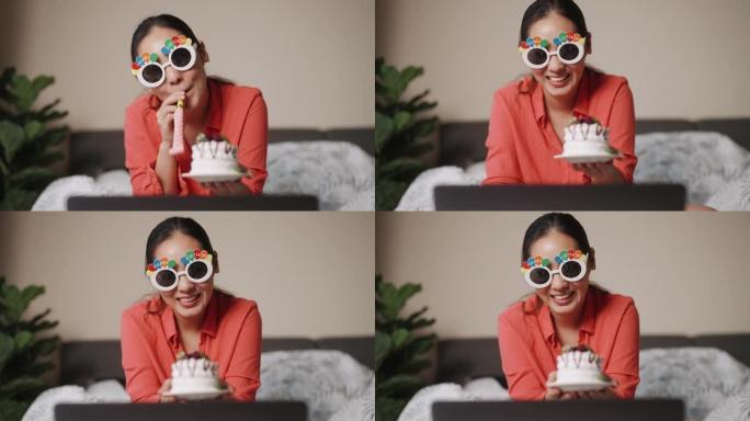 亚洲妇女与她的朋友在视频通话中生日快乐