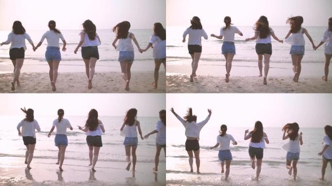 一群女性朋友快乐享受，在海滩上奔跑