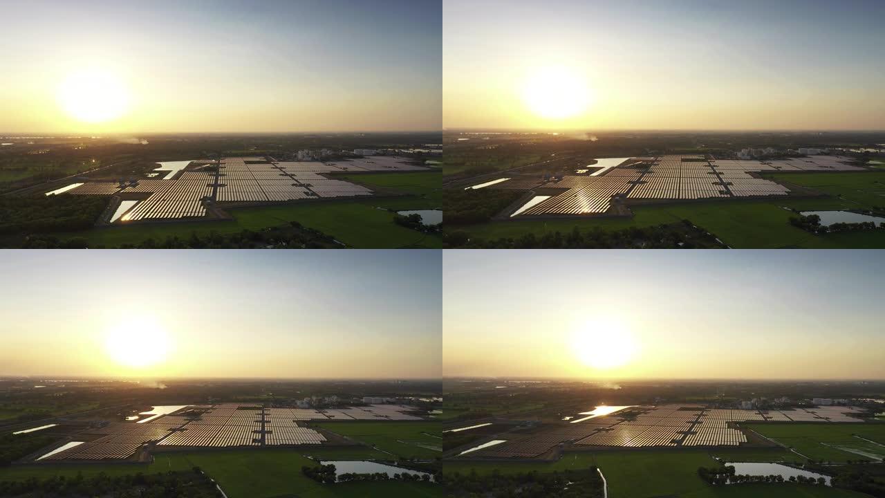 日落时太阳能电池板农场的鸟瞰图 (太阳能电池)