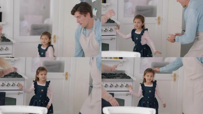 快乐的家庭在厨房跳舞孩子们玩得开心和父母一起跳舞，享受激动人心的周末在家4k镜头