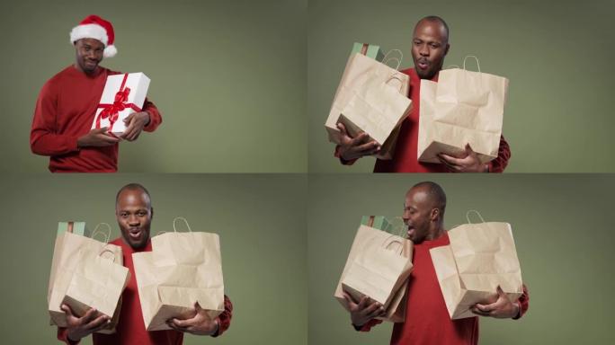 一个穿着鲜红色毛衣的快乐黑人男子用装有礼品盒的彩色袋子举起双手