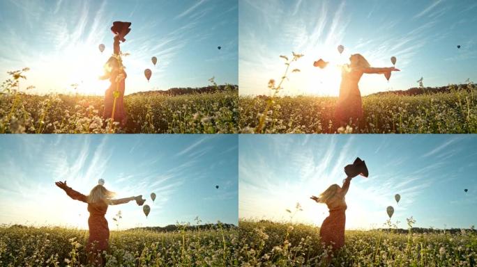 超级慢动作女人在热气球前的花田里旋转