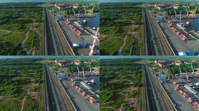 货港旁的高速公路的壮丽鸟瞰图，在圣彼得堡附近的一个岛上被绿色森林包围