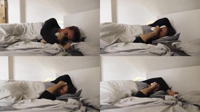 DS男子躺在床上时有严重的咳嗽发作