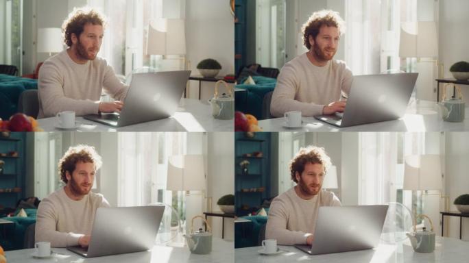 英俊的成年男子，姜黄色卷发，使用笔记本电脑，坐在公寓的客厅。有魅力的男人在家工作，网上购物，看视频或