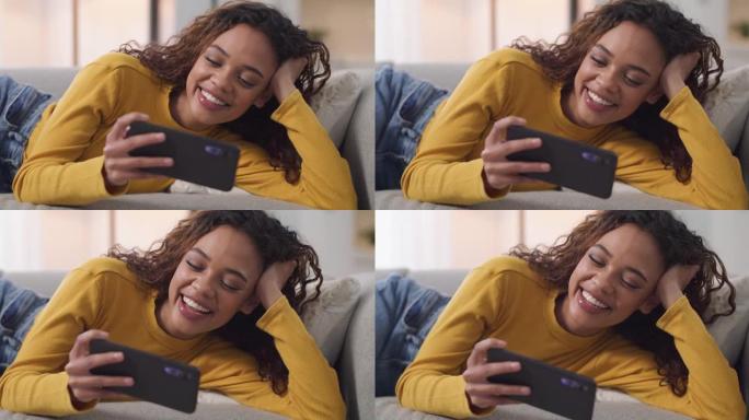一名年轻女子在家中沙发上使用智能手机的4k视频片段