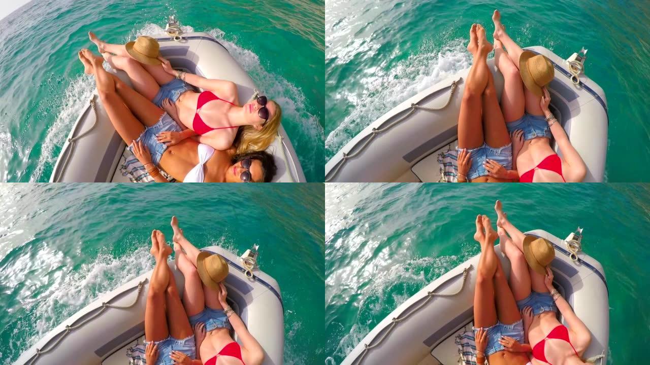 在意大利，两名迷人的年轻女性在船上晒黑的4k视频片段