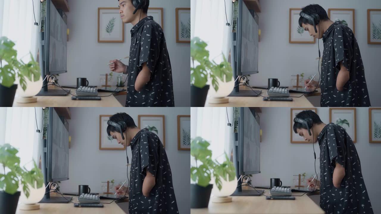 年轻的亚洲男子在家庭办公室通过电脑进行视频通话。