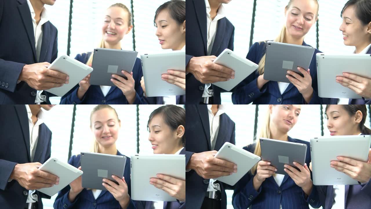 女领导用电脑平板教学辅导业务团队