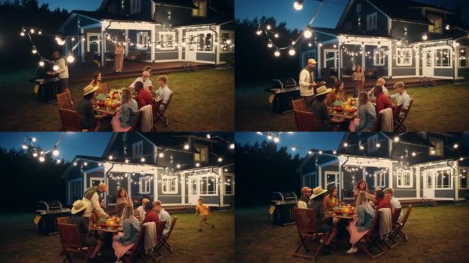 一群多民族的人在户外用餐时玩得开心，互相交流。在一个温暖的夏日傍晚，家人和朋友聚集在他们的家外。