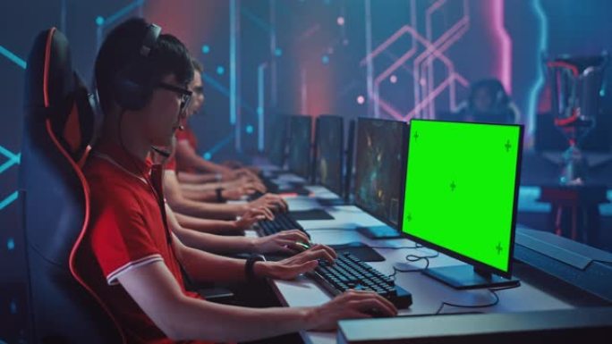 专业玩家在电子游戏中玩游戏，并在锦标赛上显示模拟绿屏。时尚霓虹灯网络游戏竞技场的职业玩家团队。锦标赛
