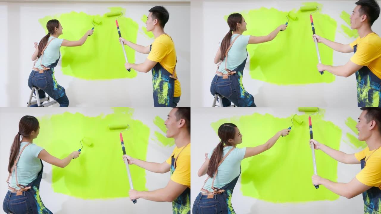 夫妇粉刷墙壁