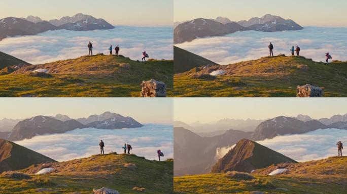 SLO MO徒步旅行者群在山顶上欣赏美景