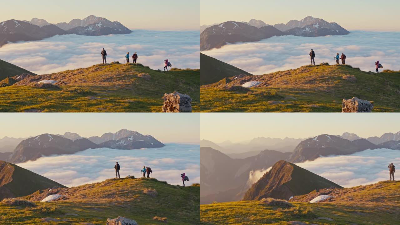 SLO MO徒步旅行者群在山顶上欣赏美景