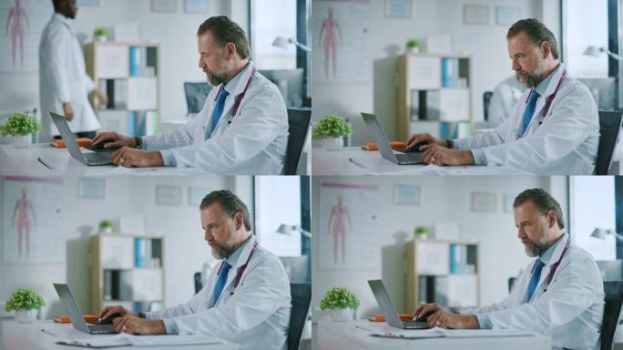 幸福家庭医生正在一家诊所的笔记本电脑上工作。穿着白大褂的医生正在医院办公室的桌子后面浏览病史。